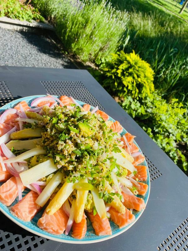 Fresh salmon ceviche salad with asparagus and quinoa