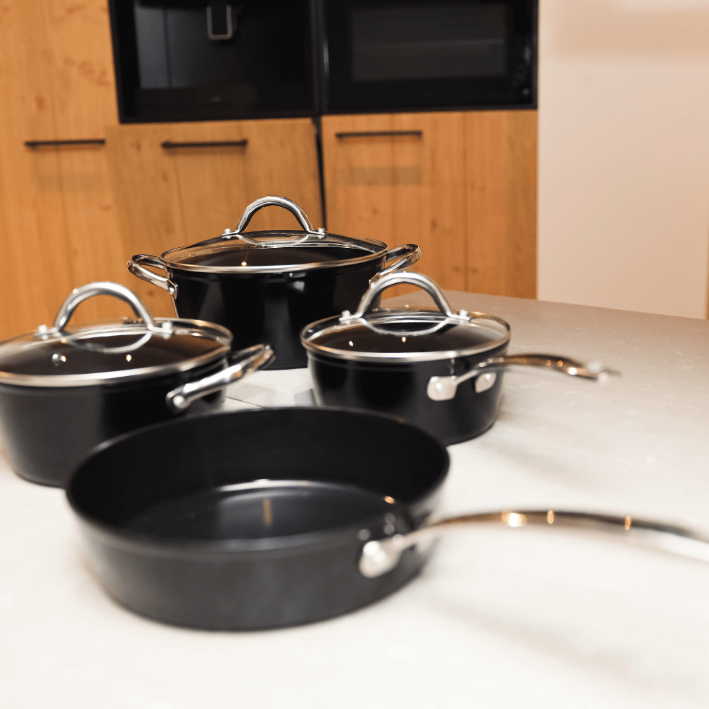 Black Signature cookware set with stainless steel handles and ceramic non-stick coating