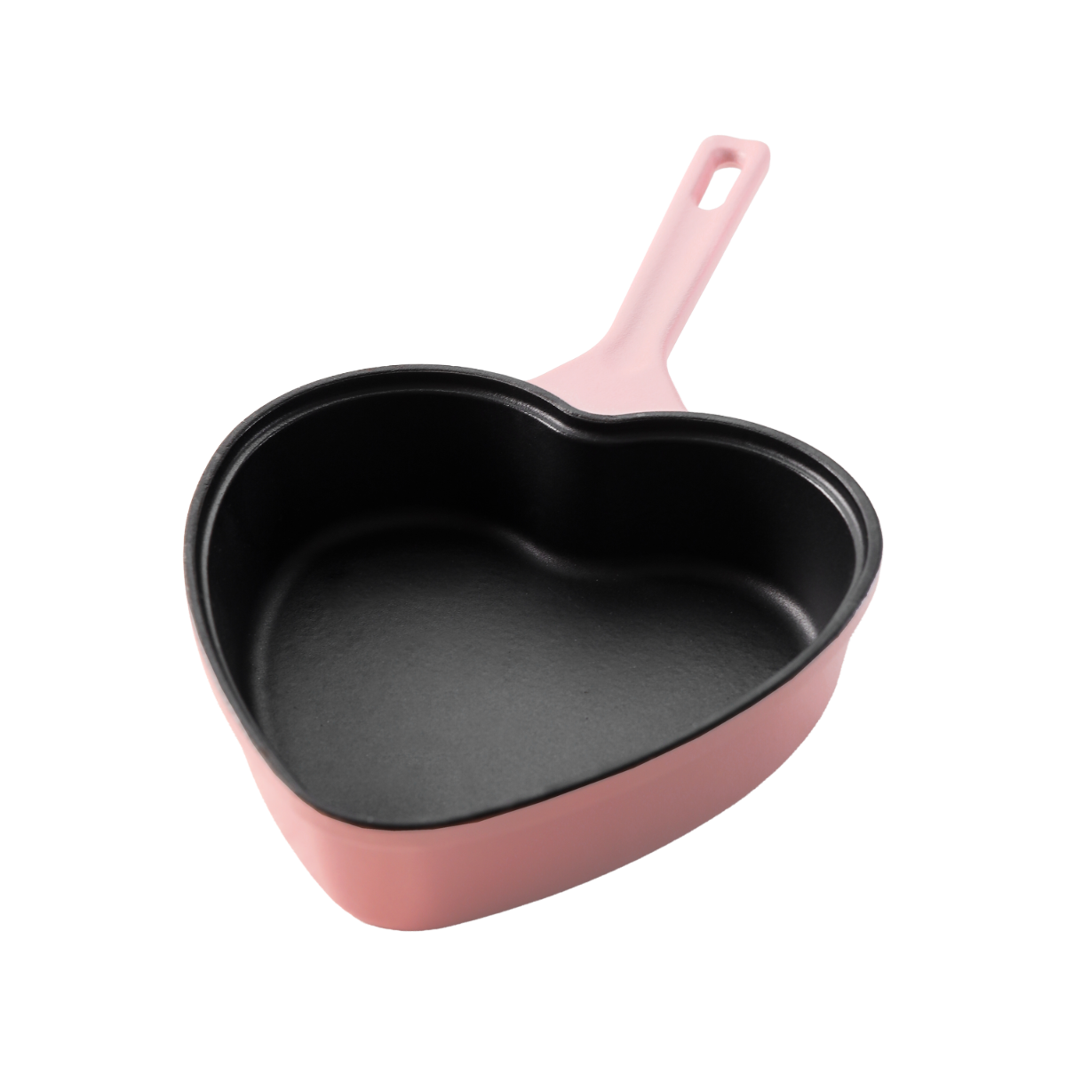 Pink cast iron frying pan in heart shape with black interior, 20 cm wide.