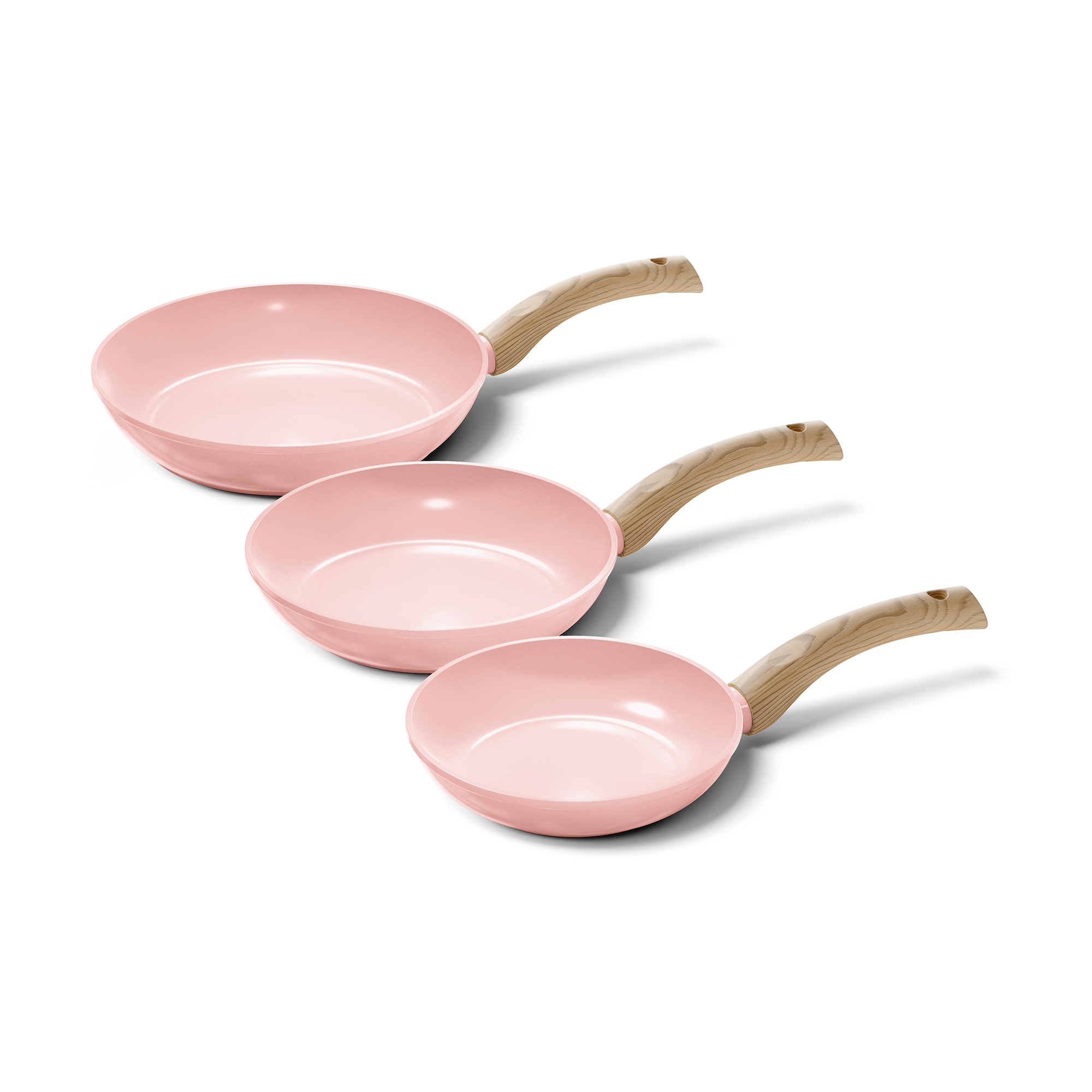 Three-piece Blush pink frying pan set with light wooden handles, varying in size.