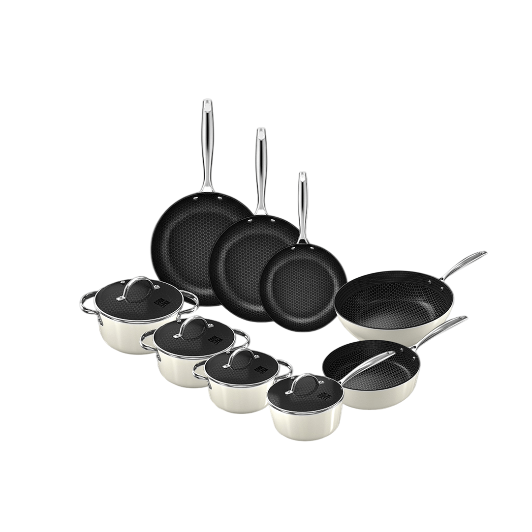 9-piece cookware set with black non-stick pans and beige stainless steel saucepans with lids.