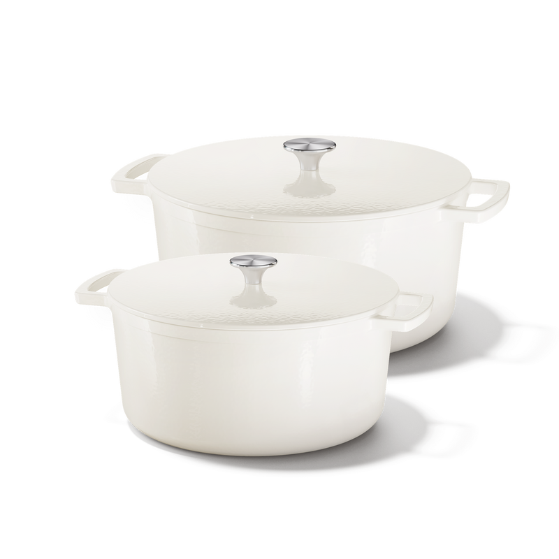 Go Ivory set of two cream cast iron Dutch ovens with lids and side handles