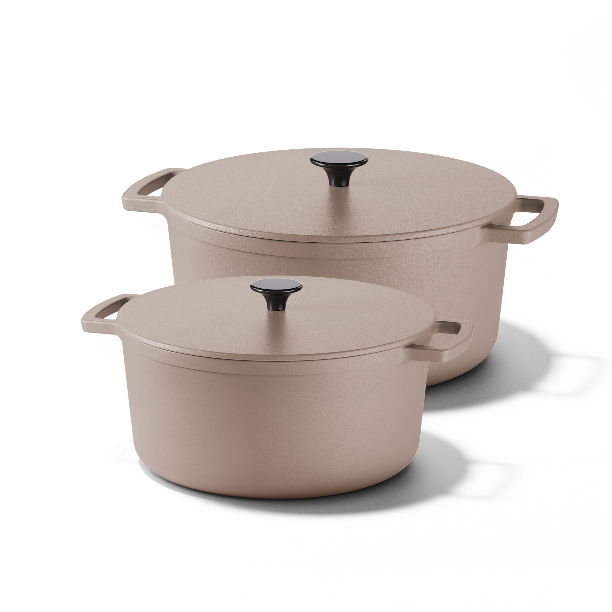 Two Taupe of Mind cast iron Dutch ovens in sand color with matching lids and side handles