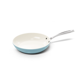 Blue frying pan 28 cm with white ceramic interior and metal handle.
