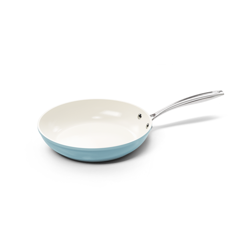 Blue frying pan 28 cm with white ceramic interior and metal handle.