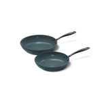 Deux poêles anthracite avec revêtement antiadhésif et poignées métalliques.