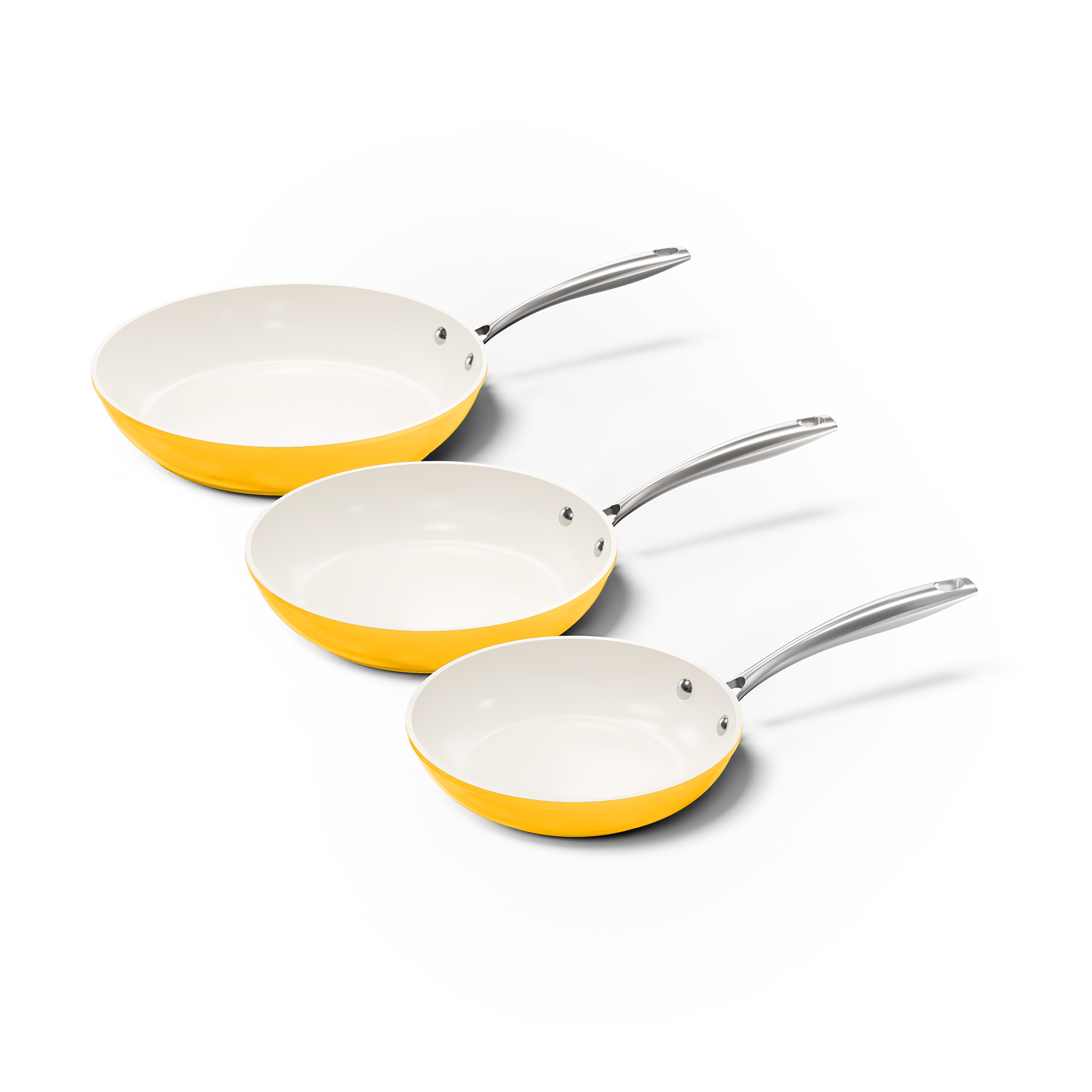 Set van drie gele koekenpannen met witte binnenkant en metalen handvatten in verschillende maten.