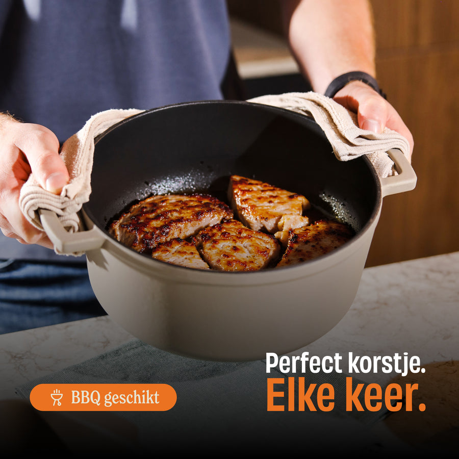 Golden brown crusts on chicken in a taupe dutch oven, suitable for BBQ.