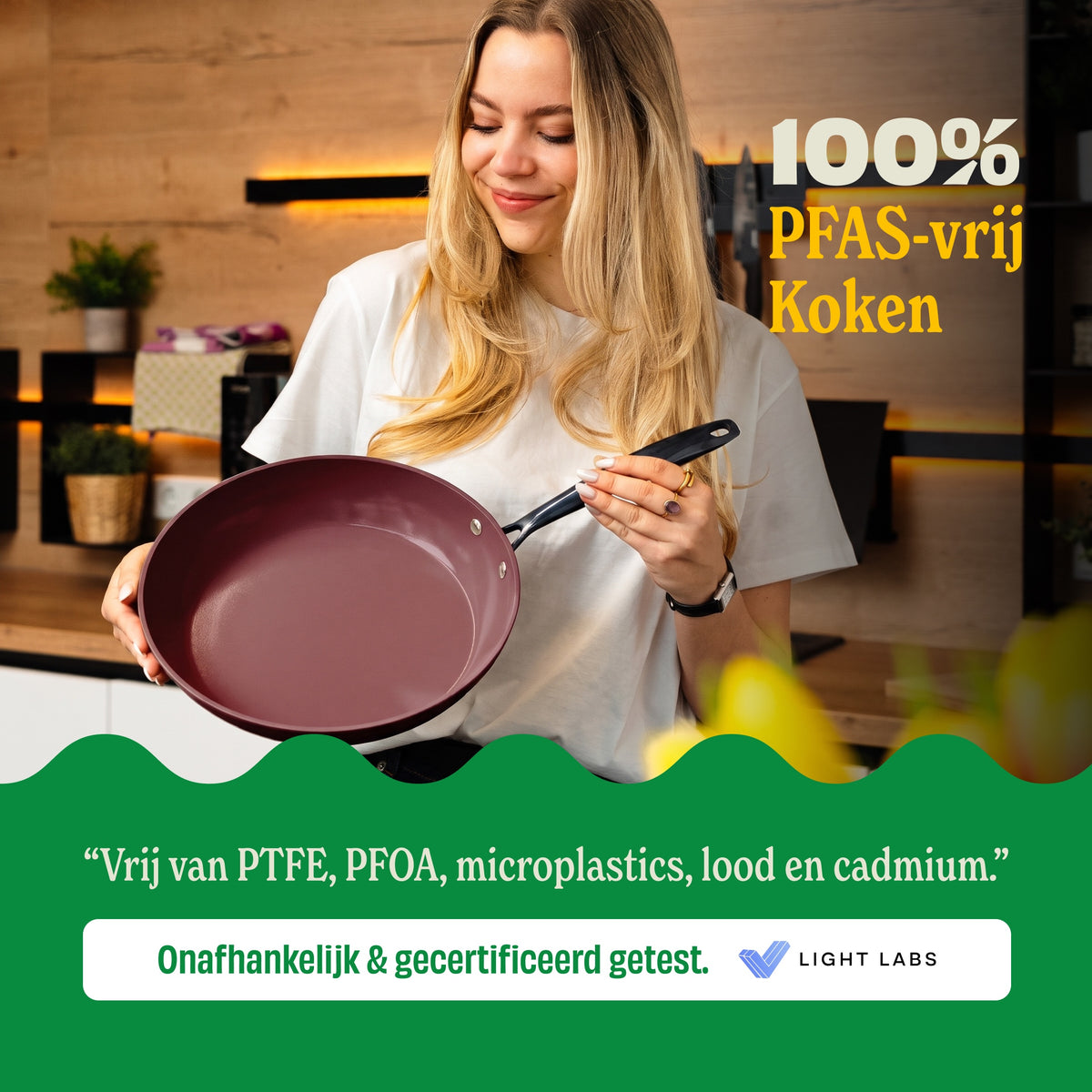 Woman holding a Cherry frying pan, 100% PFAS-free cooking