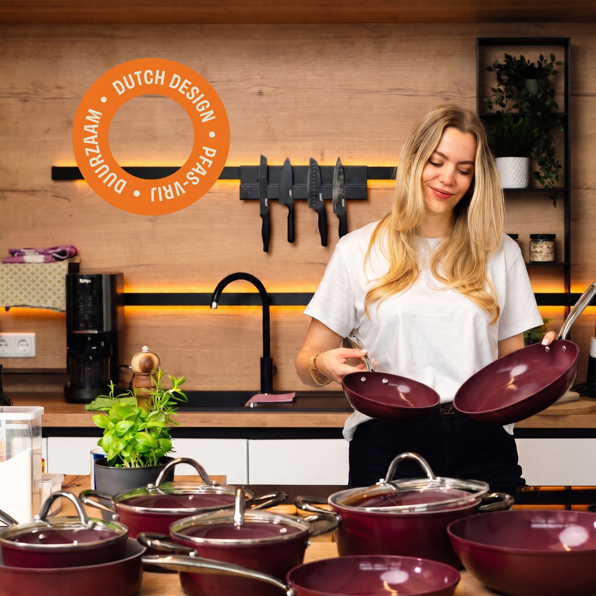 Woman with Cherry frying pans in the kitchen, sustainable and PFAS-free